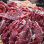 Raw sliced beef on a bamboo tray for beef hotpot